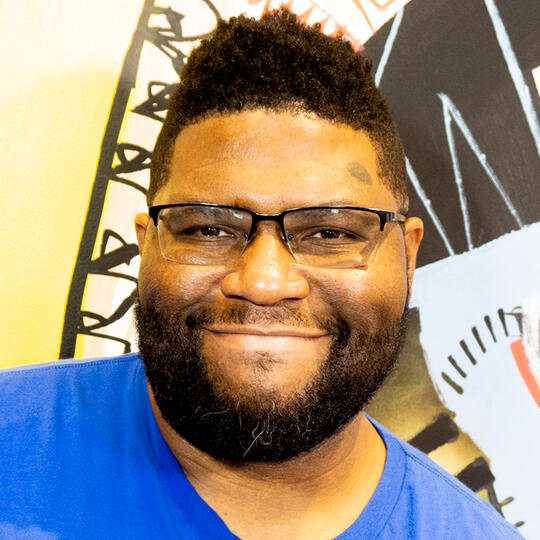 A digital portrait of an East Asian person, looking back at the "camera," wearing a tank, drinking from a juice box.